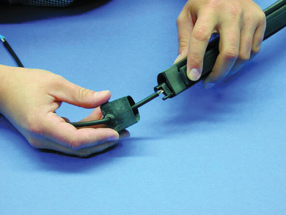 10. Apply the terminals in the copper strings. Thread on the gable plug to see that it fits.