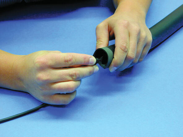 10. Apply the terminals in the copper strings. Thread on the gable plug to see that it fits.