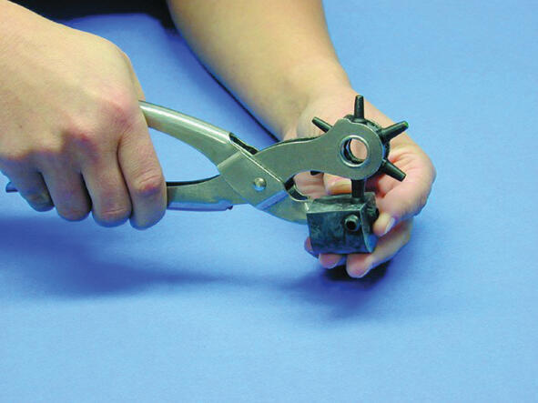 8. Use a pair of cancels to make holes in the cable entrance that is to be used.